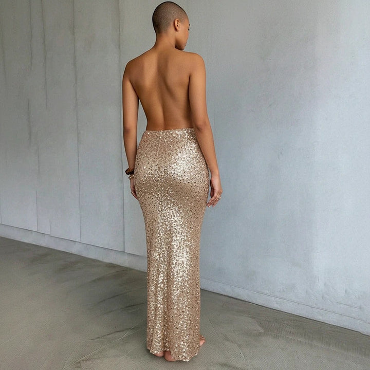 Sea Dragon Dreams gold sequin maxi beach cover-up skirt worn by a model, featuring a shimmering floor-length design.