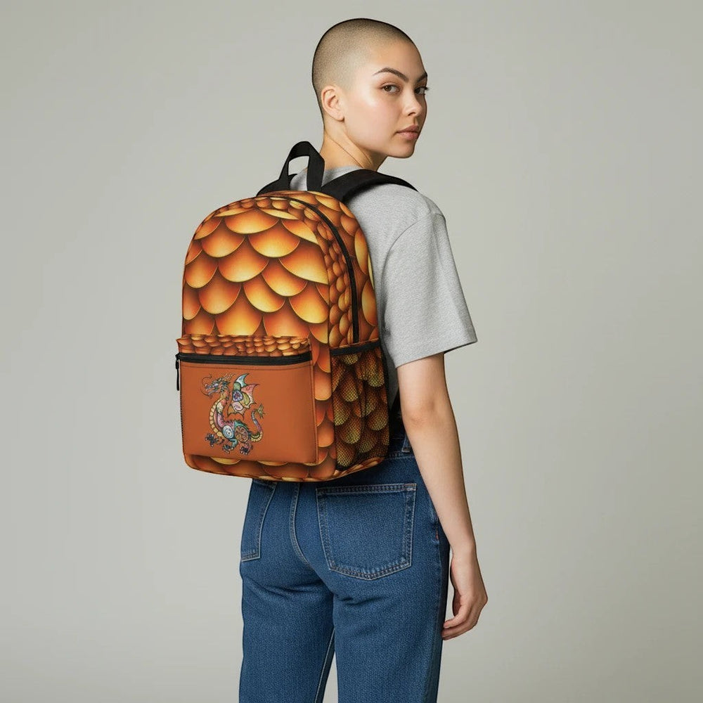 Sea Dragon Dreams golden dragon scale backpack worn by a model, featuring a vibrant fantasy print and front pocket.