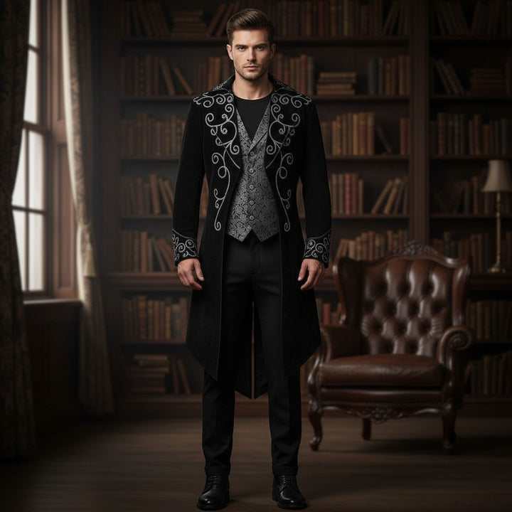 Sea Dragon Dreams men's black Gothic tailcoat with silver embroidery, worn by a model in a library setting.