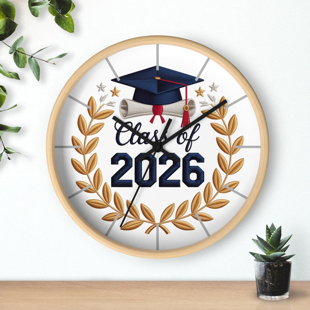 Sea Dragon Dreams Class of 2026 graduation wall clock with a natural wood frame, gold laurel wreath, and cap design.