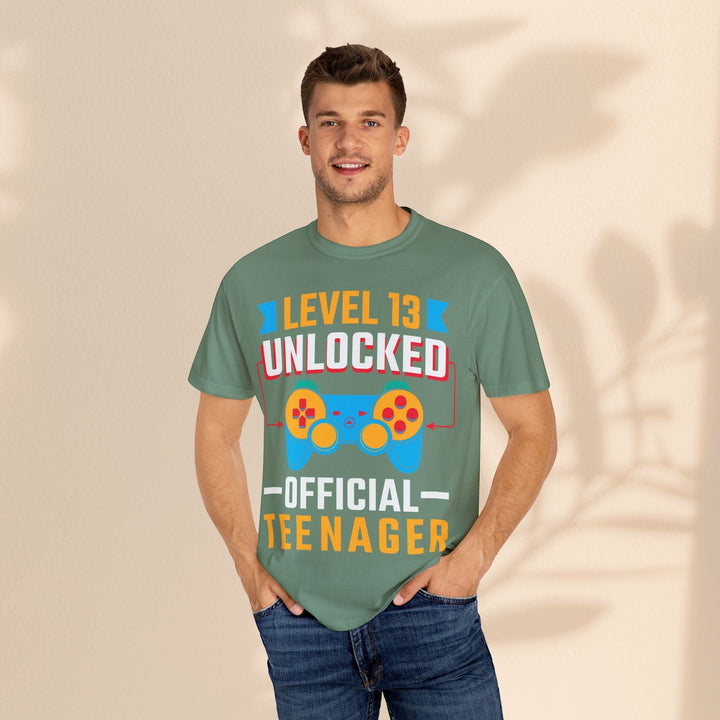 Sea Dragon Dreams unisex green cotton t-shirt featuring a Level 13 Unlocked Official Teenager gamer graphic print