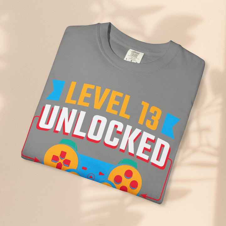 Sea Dragon Dreams grey cotton gamer t-shirt featuring a Level 13 Unlocked graphic with a retro game controller design.
