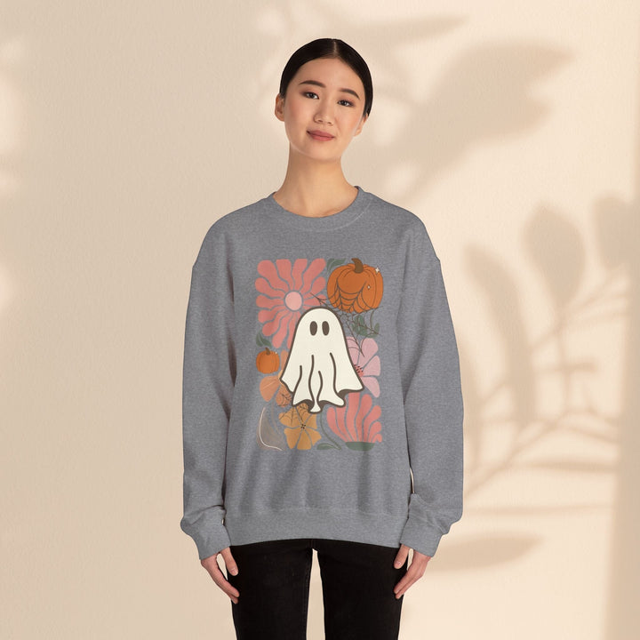Model wearing a Sea Dragon Dreams grey crewneck sweatshirt with a ghost, pumpkin, and floral graphic print.