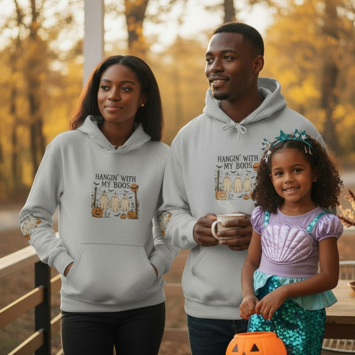 Sea Dragon Dreams grey Halloween hooded sweatshirt with Hanging With My Boos ghost design worn by a family outdoors