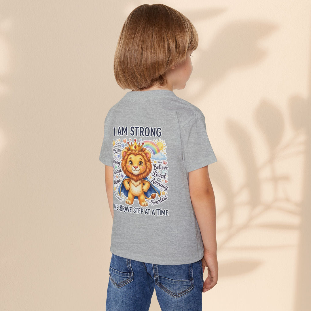 Sea Dragon Dreams toddler t-shirt in grey cotton featuring a courageous lion graphic and I Am Strong affirmation.