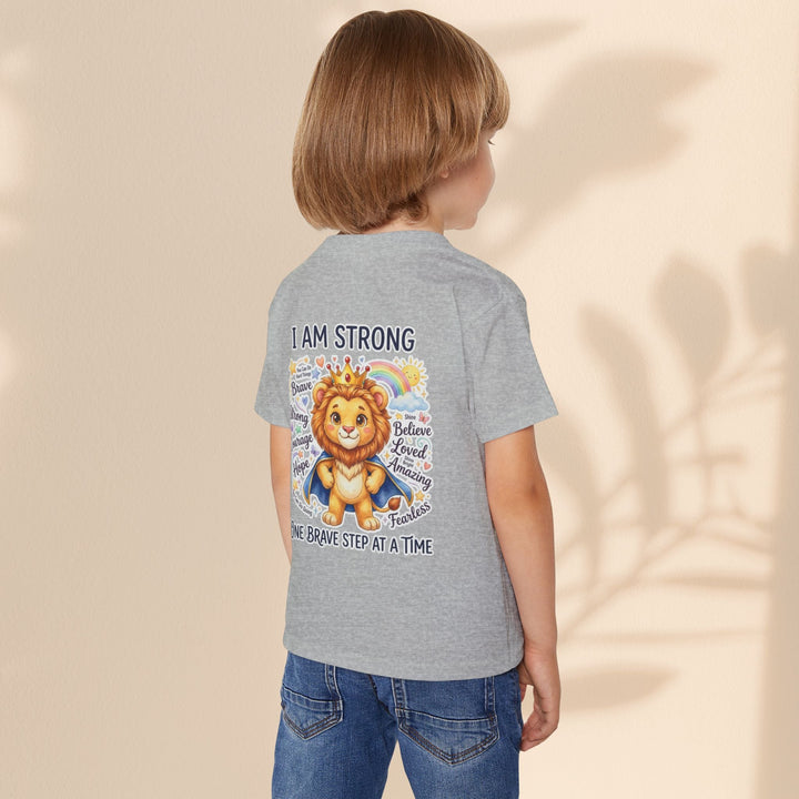 Sea Dragon Dreams toddler t-shirt in grey cotton featuring a courageous lion graphic and I Am Strong affirmation.