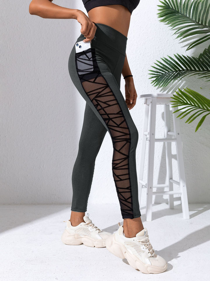 Sea Dragon Dreams high-waist workout leggings in dark grey with black mesh panels and side phone pocket
