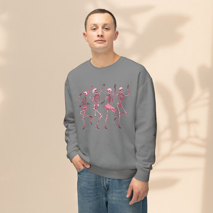 Sea Dragon Dreams grey crewneck sweatshirt featuring a pink dancing skeletons graphic on a man in blue jeans