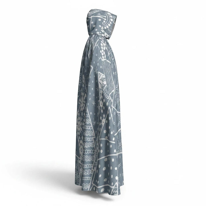 Sea Dragon Dreams unisex hooded cloak in grey with white snowflake and geometric winter pattern, side view.