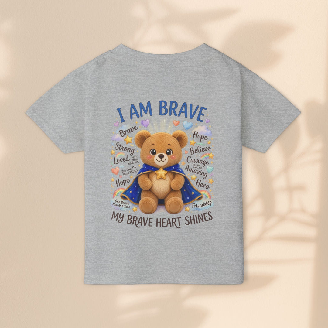 Sea Dragon Dreams toddler t-shirt in sport grey cotton featuring a teddy bear graphic with I Am Brave text.