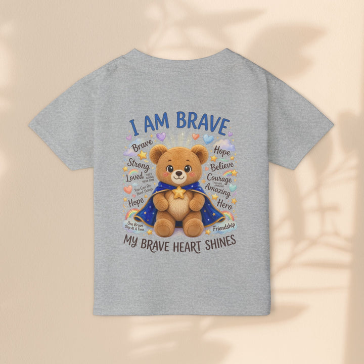 Sea Dragon Dreams toddler t-shirt in sport grey cotton featuring a teddy bear graphic with I Am Brave text.