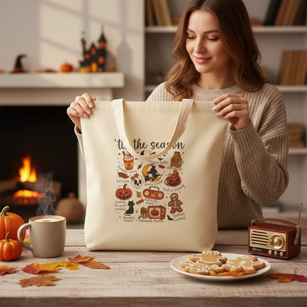 Sea Dragon Dreams natural cotton canvas tote bag with festive Halloween illustrations held by a smiling woman