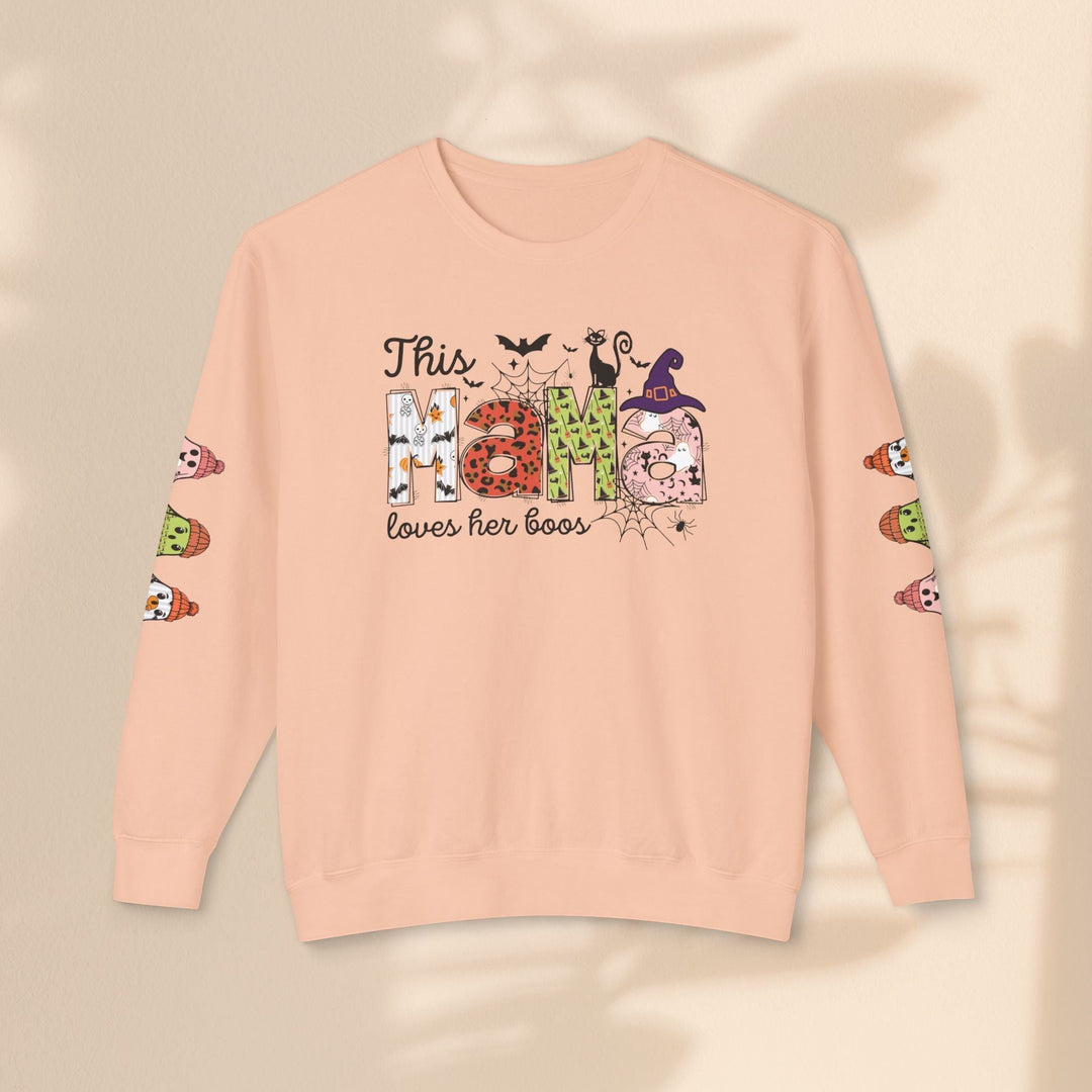 Sea Dragon Dreams peach crewneck sweatshirt with This Mama Loves Her Boos Halloween graphic and sleeve prints.
