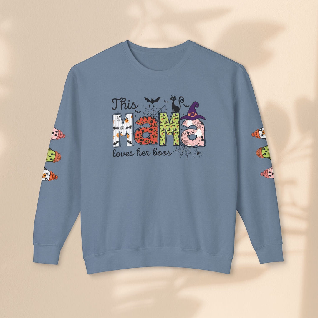 Sea Dragon Dreams blue crewneck sweatshirt with This Mama Loves Her Boos Halloween graphic and sleeve ghost prints.