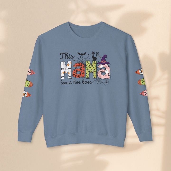 Sea Dragon Dreams blue crewneck sweatshirt with This Mama Loves Her Boos Halloween graphic and sleeve ghost prints.