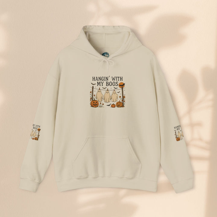 Sea Dragon Dreams cream-colored Halloween hoodie with a ghost and pumpkin graphic and sleeve print.