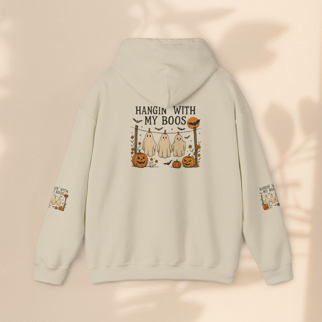 Sea Dragon Dreams cream-colored Halloween hoodie with a ghost and pumpkin graphic on the back and sleeve details.