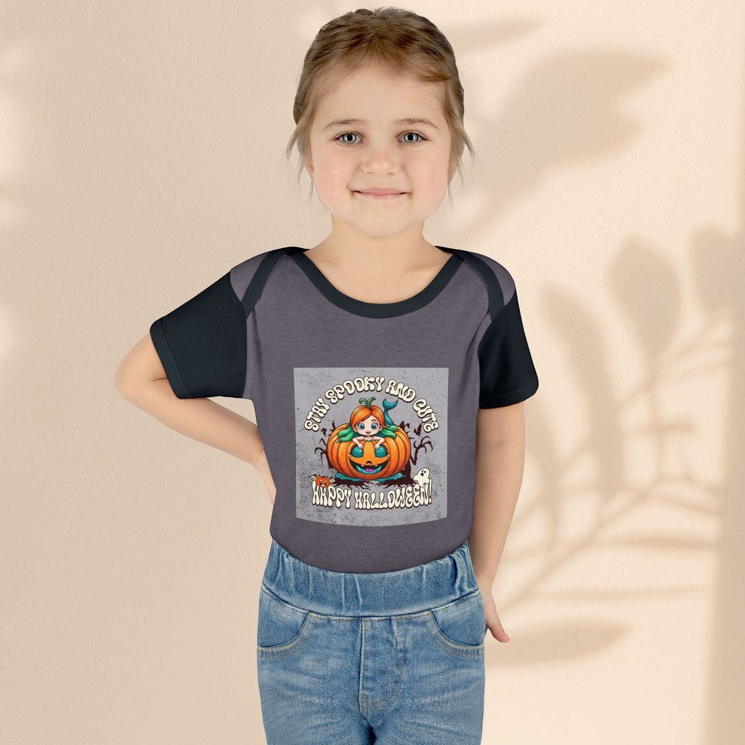 Sea Dragon Dreams infant bodysuit featuring a Stay Spooky and Cute pumpkin Halloween graphic on soft cotton fabric.