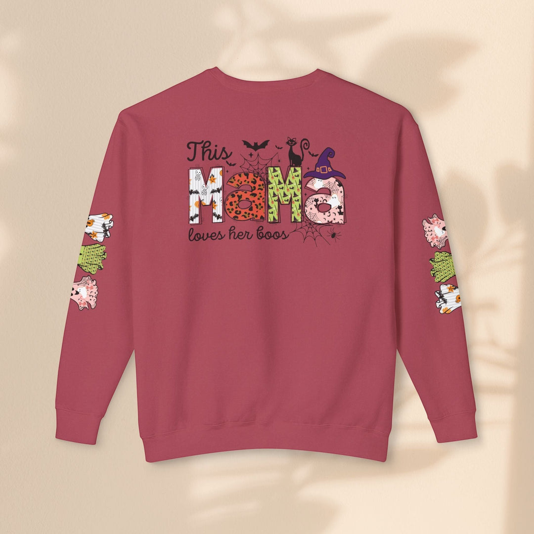 Sea Dragon Dreams This Mama Loves Her Boos Halloween crewneck sweatshirt in dusty rose with festive sleeve graphics.