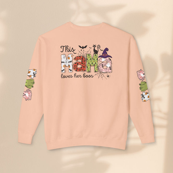 Sea Dragon Dreams peach crewneck sweatshirt with This Mama Loves Her Boos Halloween print on back and ghost sleeves.