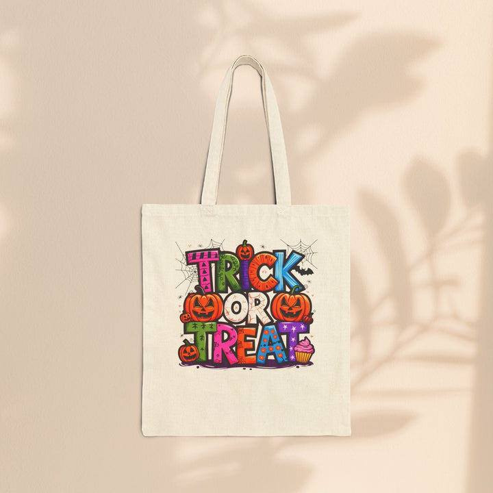 Sea Dragon Dreams natural cotton canvas tote bag with colorful Trick or Treat Halloween graphic print.