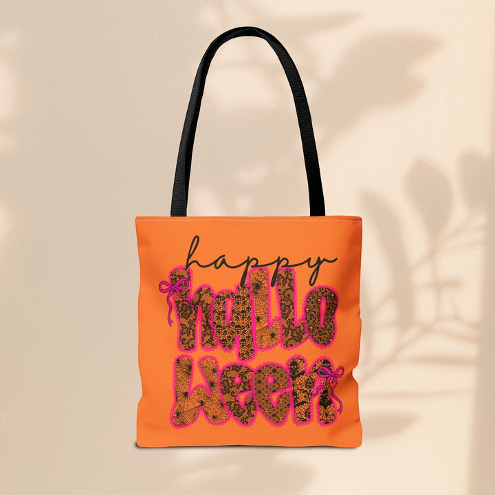 Sea Dragon Dreams Happy Halloween tote bag in orange with black text, spiderweb patterns, and pink bow accents.