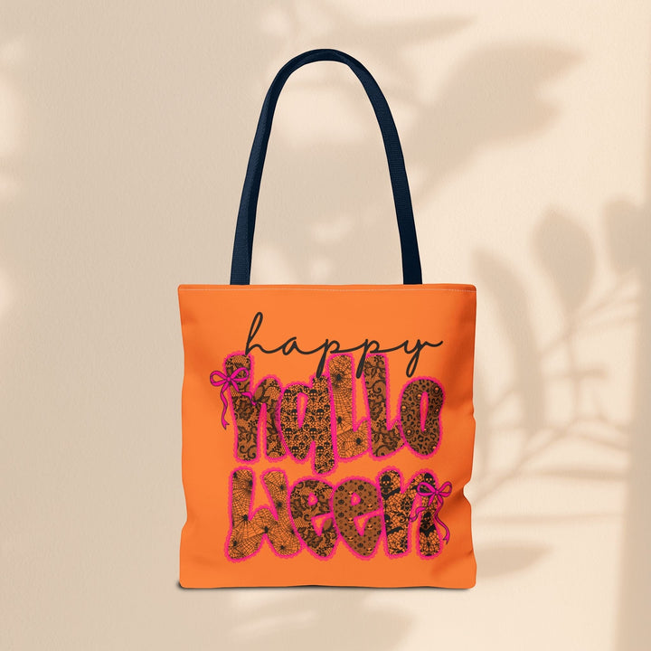 Sea Dragon Dreams orange polyester tote bag with Happy Halloween text in a black spiderweb and leopard print pattern.