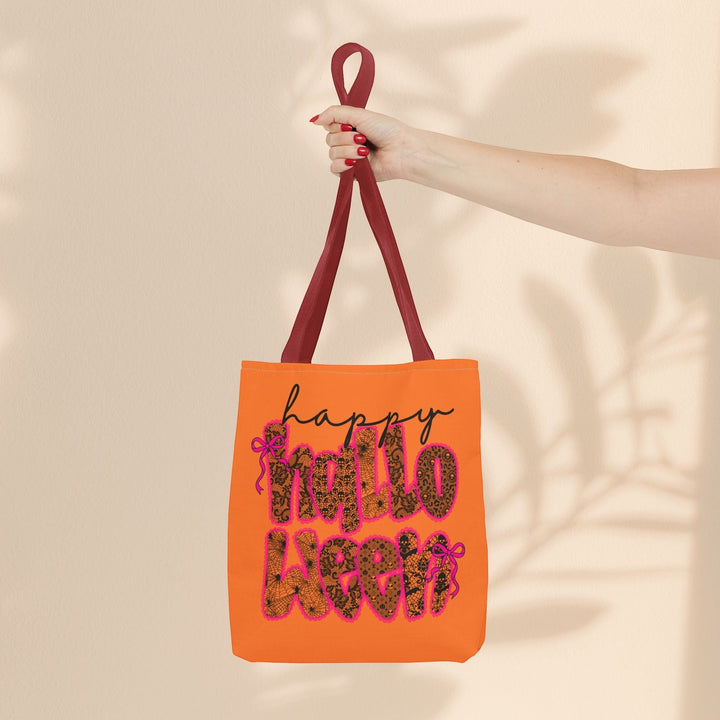 Sea Dragon Dreams orange polyester tote bag with Happy Halloween leopard print text and dark red handles.