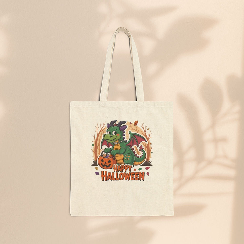 Sea Dragon Dreams natural cotton canvas tote bag featuring a cute green dragon with a pumpkin for Halloween.