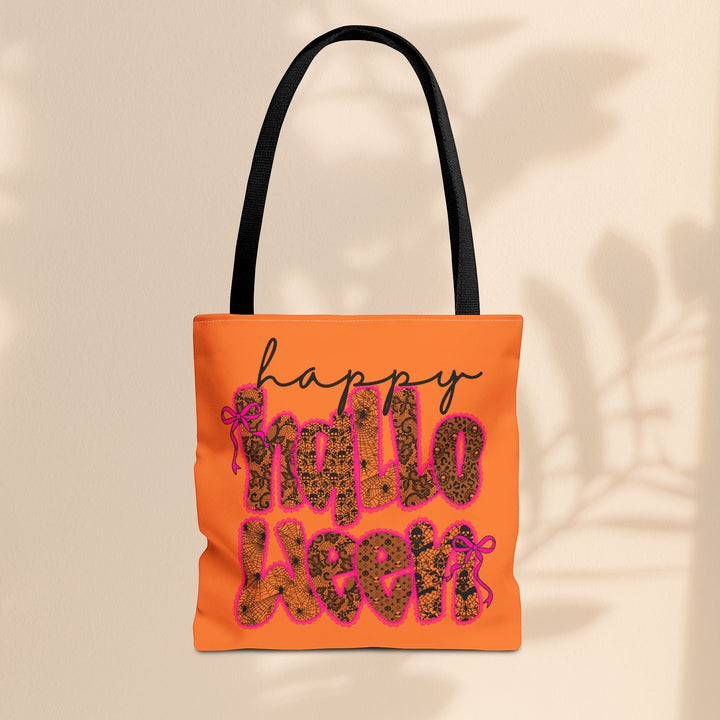 Sea Dragon Dreams Happy Halloween tote bag in orange with black handles and a festive leopard print text design.