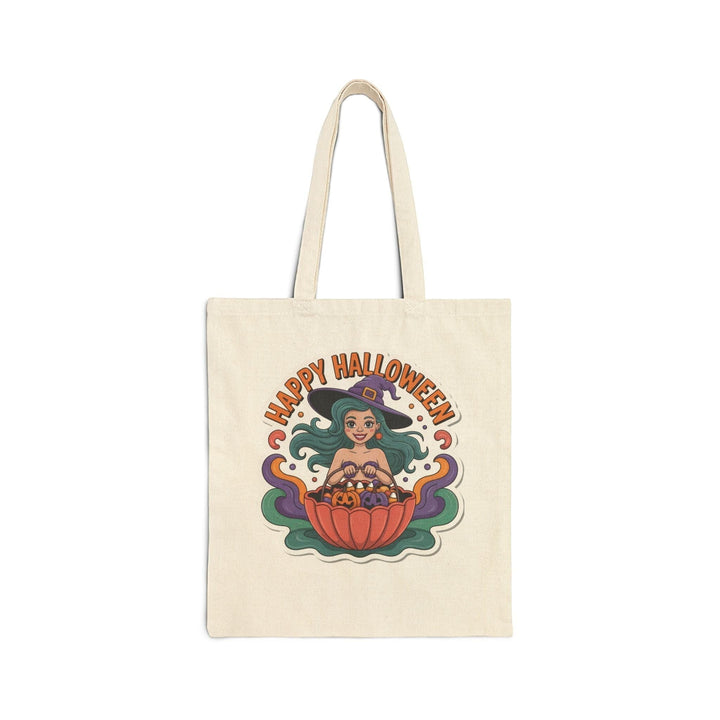 Sea Dragon Dreams cotton canvas tote bag featuring a cartoon witch with teal hair holding a pumpkin bucket for Halloween