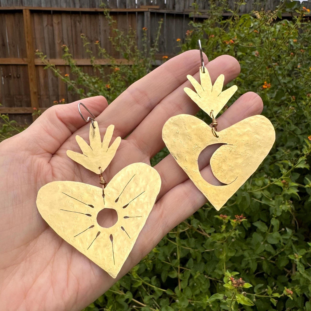 Sea Dragon Dreams XL sacred heart earrings with sun and moon cutouts, handcrafted in hammered brass.