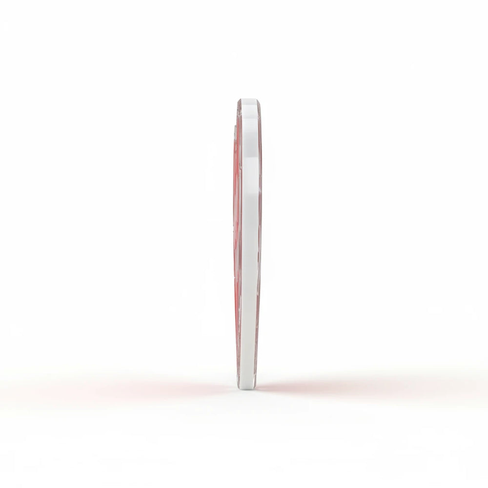 Side view of a Sea Dragon Dreams heart-shaped acrylic statue with a smooth, thick, and glossy finish.