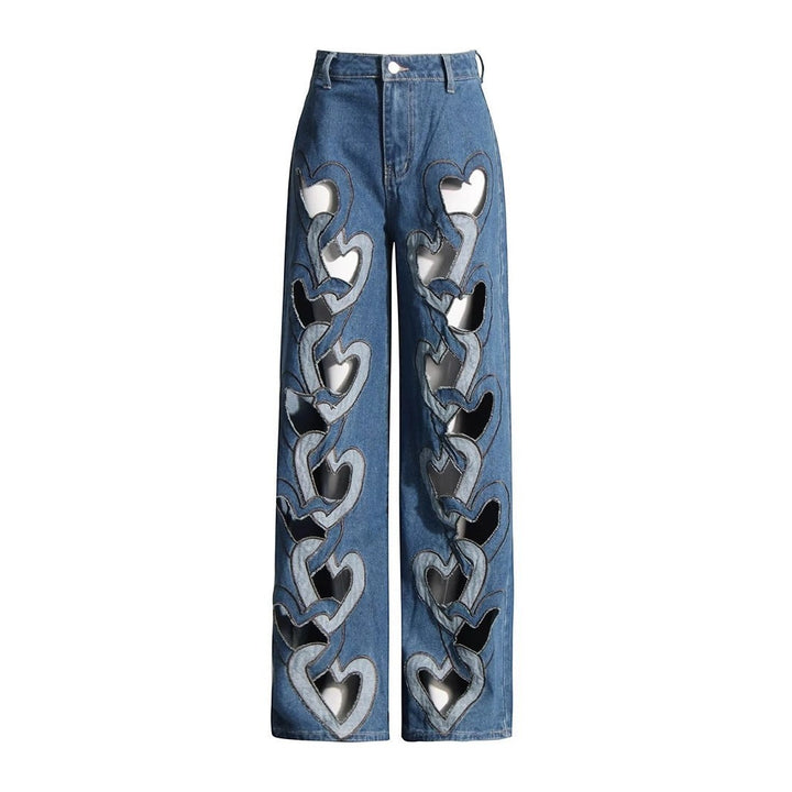 Sea Dragon Dreams high-waisted blue denim jeans with a wide-leg fit and repeating heart-shaped cutout details.