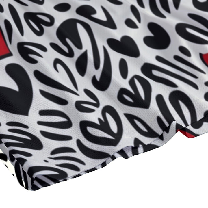 Sea Dragon Dreams men's swim shorts featuring a colorful heart pattern on white polyester fabric