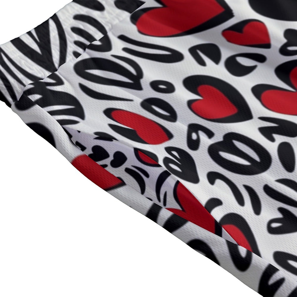 Sea Dragon Dreams men's swim shorts featuring a colorful red and black heart pattern on white polyester fabric
