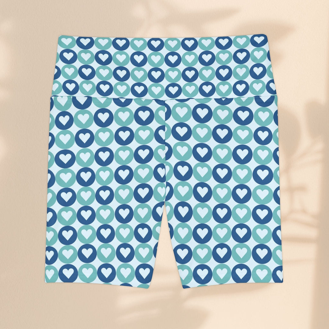 Sea Dragon Dreams workout shorts in blue and teal with a repeating heart pattern, made from quick-dry polyester.