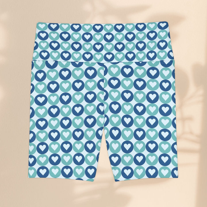 Sea Dragon Dreams workout shorts in blue and teal with a repeating heart pattern, made from quick-dry polyester.