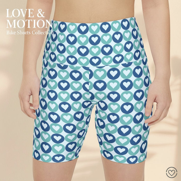 Sea Dragon Dreams women's workout bike shorts featuring a blue and teal heart pattern on lightweight polyester fabric.