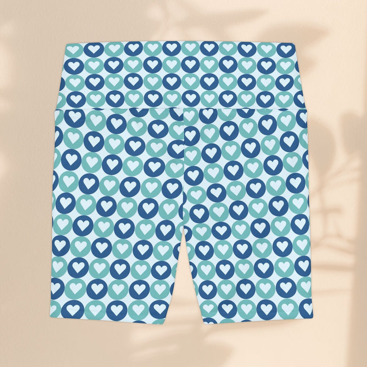 Sea Dragon Dreams women's workout shorts featuring a blue and teal heart pattern on lightweight polyester fabric.