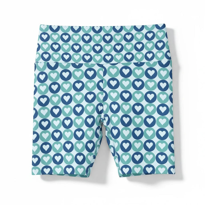 Sea Dragon Dreams women's workout shorts in polyester with a blue and teal heart pattern and high waistband.