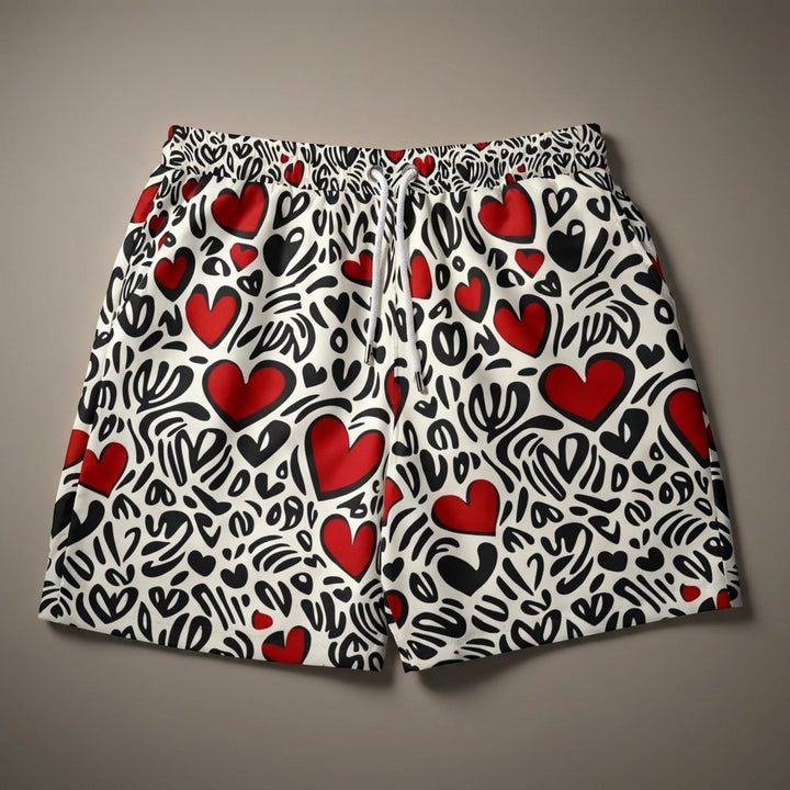 Sea Dragon Dreams heart pattern swim shorts with red and black abstract heart print on white stretch fabric.