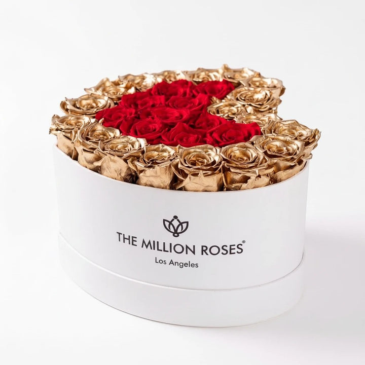 Sea Dragon Dreams heart-shaped white box filled with preserved red roses and 24K gold-dipped roses for luxury gifting.