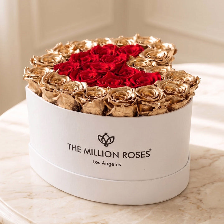 Sea Dragon Dreams heart-shaped white box filled with preserved red roses and 24K gold-dipped roses as a luxury gift.