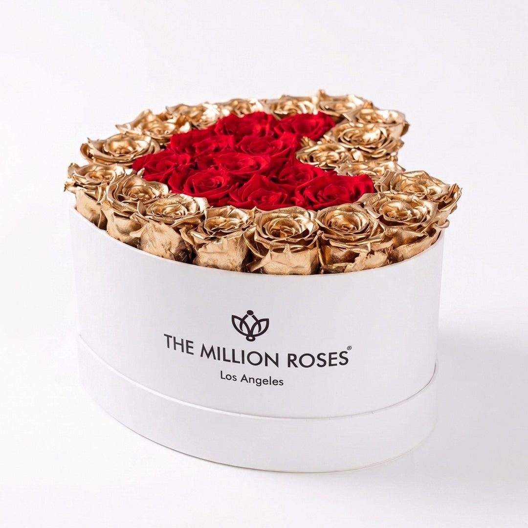 Sea Dragon Dreams heart-shaped white box filled with preserved red roses and 24K gold-dipped roses as a luxury gift.