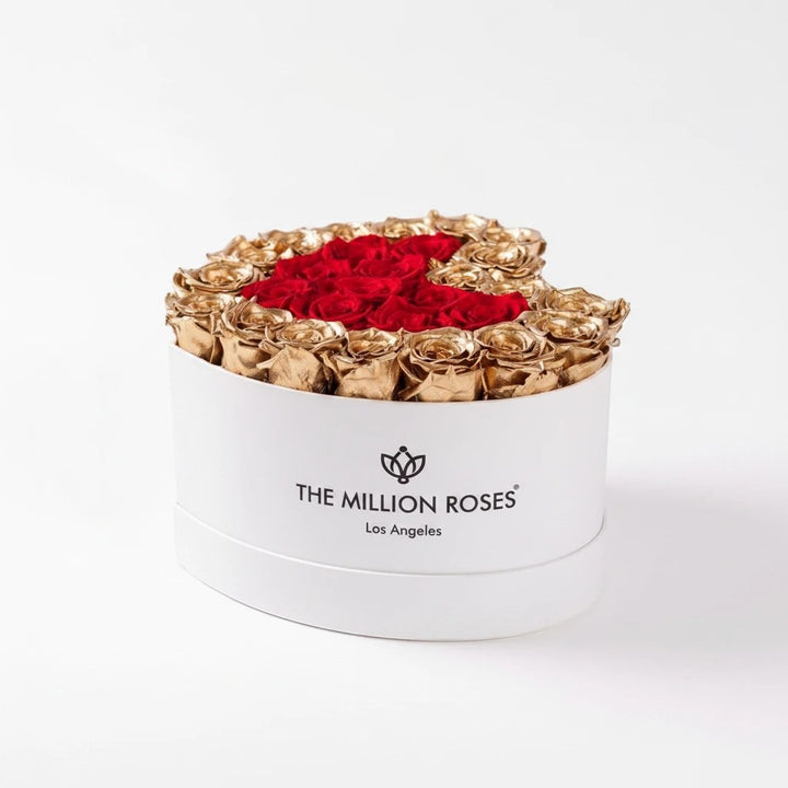 Sea Dragon Dreams heart-shaped white box filled with preserved red roses and 24K gold roses for a luxury gift.