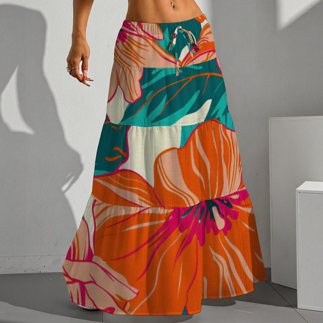 Sea Dragon Dreams pleated maxi skirt with vibrant orange, teal, and pink hibiscus floral print and drawstring waist