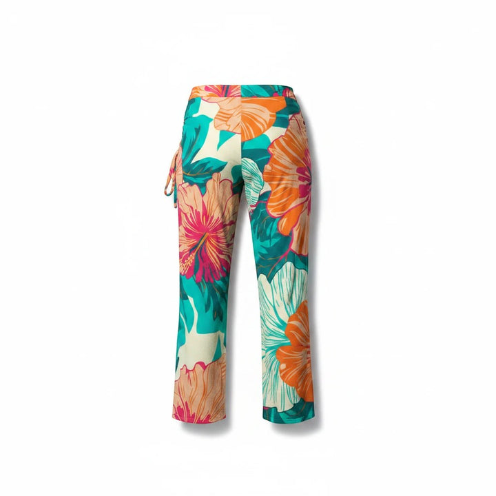 Sea Dragon Dreams high-waist wide-leg pants with a tropical hibiscus floral print in orange, pink, and teal.