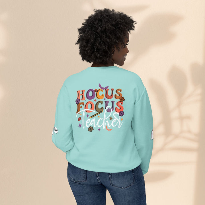Sea Dragon Dreams light blue crewneck sweatshirt with Hocus Focus Teacher Halloween graphic on the back