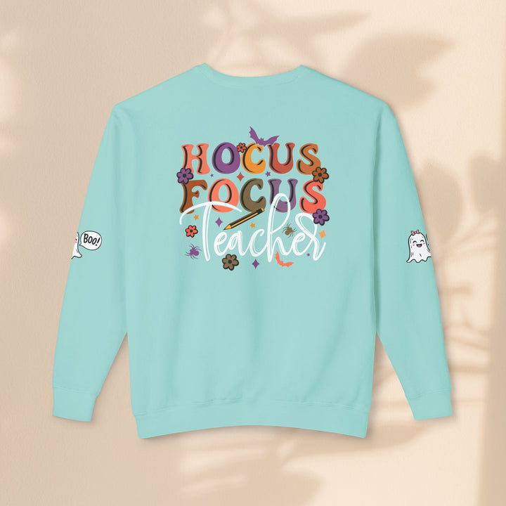 Sea Dragon Dreams light blue crewneck sweatshirt with Hocus Focus Teacher Halloween graphic on the back